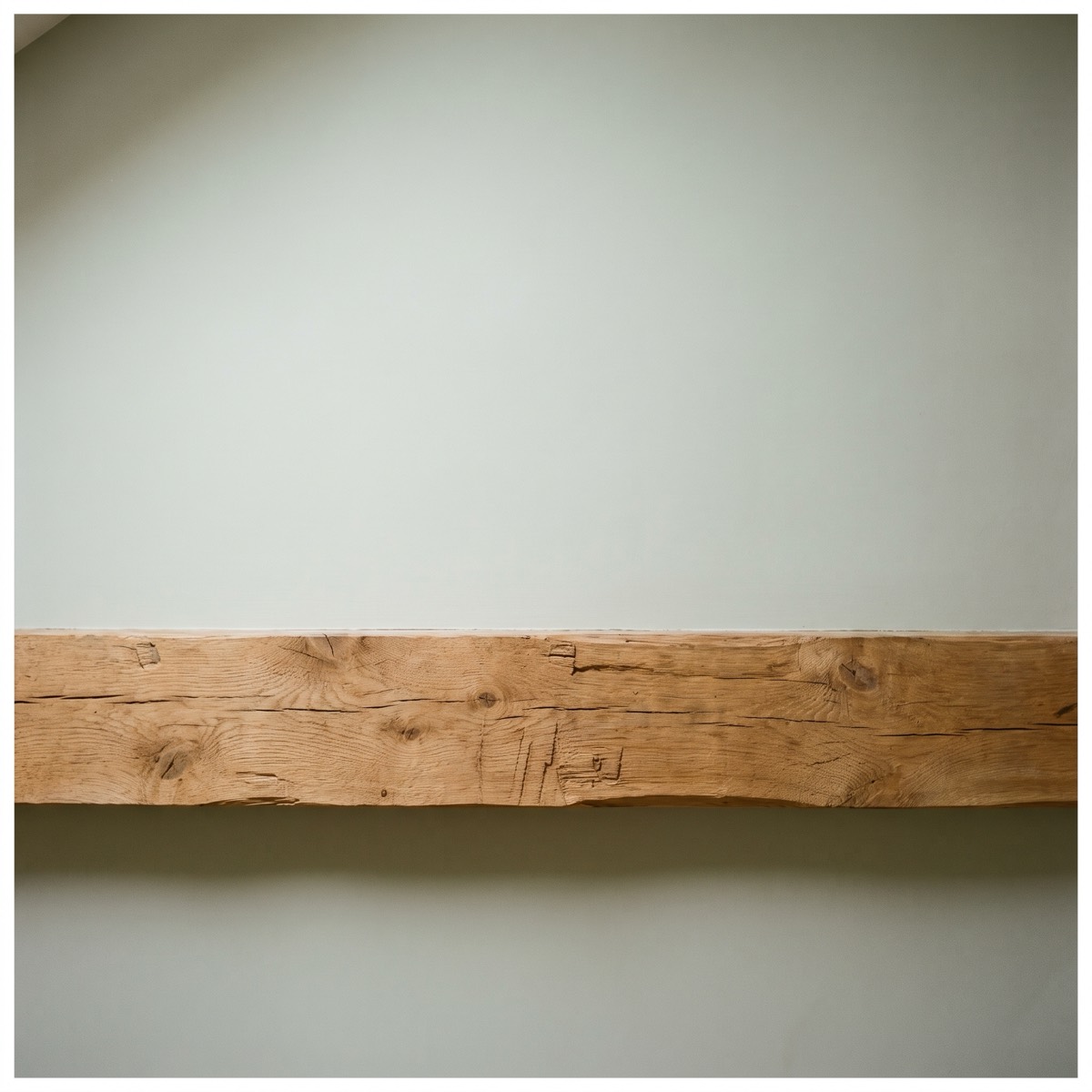 An exposed timber beam spanning a wall, a structural surface that needs checking for level